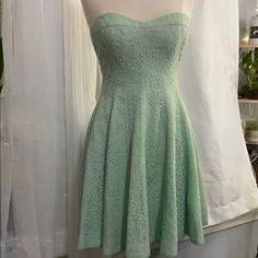 Pastel Green Lace Strapless Dress Zips In Back And Has A Liner All Thru Out Dress Size 4 Spring Dress With Sweetheart Neckline And Stretch, Spring Green Strapless Dress With Fitted Bodice, Spring Strapless Lace Dress With Fitted Bodice, Spring Lace Strapless Dress With Fitted Bodice, Flirty Lace Strapless Dress For Spring, Spring Strapless Lace Dress For Brunch, Lace Strapless Dress For Brunch, Fitted Green A-line Strapless Dress, Light Green Strapless Dress