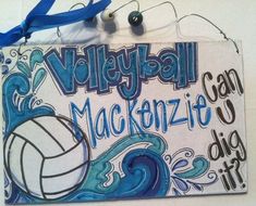 a sign hanging from the side of a wall that says volleyball macken - tio