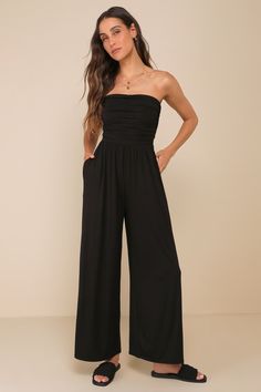 From casual occasions to upscale events, the LUSH Flirty Posture Black Jersey Knit Strapless Jumpsuit is ready for anything! Soft and stretchy jersey knit shapes this covetable jumpsuit that has a strapless bodice with a straight neckline. Flattering ruched details at the sides continue down to a fitted waist. Wide legs have side-seam pockets and end at full-length hems. Fit: This garment fits true to size. Length: Floor length. Size medium measures 48.5" from top to bottom. Inseam: 28.00 Front Black Strapless Jumpsuit Outfit, Strapless Jumpsuit Outfit, Black Strapless Jumpsuit, Strapless Romper, Jumpsuit Outfit, Strapless Jumpsuit, Adhesive Bra, Black Jersey, Straight Neckline