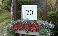 a sign that says 70 with flowers in it