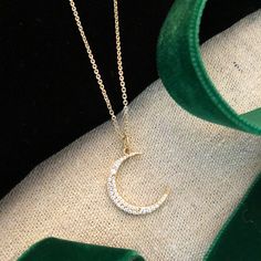 Our stunning crescent moon charm is a great addition to any layer up of symbols and talismans. The moon can represent changes through time as the moon goes through phases and is also a symbol of the Goddess Diana who was patron goddess of the moon. Sterling silver plated in 14K gold with cubic zirconia stones. 16" chain with extension. All orders over $50 ship for free within the USA. All orders usually ship within 24 hours from the USA. Goddess Diana, Goddess Of The Moon, Moon Charm, The Goddess, Crescent Moon, Crescent, The Moon, Silver Plated, Cubic Zirconia