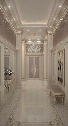 an elegant hallway with chandelier and marble flooring is seen in this image