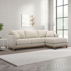 a living room with a white brick wall