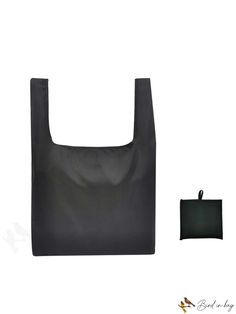 a large black bag next to a wallet