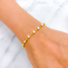 This timeless 18k gold bracelet, weighing 10.9 grams, features a classic design adorned with 0.52 carats of round brilliant cut diamonds. The diamonds have a color grade of F-G and a quality grade of VS, adding exceptional sparkle and elegance. The yellow gold finish enhances its luxurious appeal, making it perfect for any special occasion. The bracelet has a size of 7 inches, offering both style and comfort. This piece is openable, designed with a push snap lock and clasps for added convenience Timeless Cubic Zirconia Chain Bracelet For Anniversary, Cubic Zirconia Chain Bracelet With Prong Setting For Anniversary, Anniversary Chain Bracelet With Cubic Zirconia, White Diamond Bracelet For Everyday Luxury, Classic Diamond White Gold Bracelet With Cubic Zirconia, Classic Gold Bracelet With Cubic Zirconia In Diamond White, White Diamond Chain Bracelet In Fine Jewelry Style, Anniversary Chain Bracelet With Brilliant Cut Cubic Zirconia, Dainty Yellow Gold Cubic Zirconia Tennis Bracelet