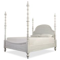 a white bed with four posts on the headboard and foot board is shown in front of a white background