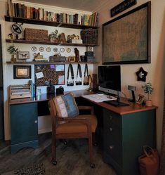 a desk with a chair, bookshelf and shelves on the wall above it