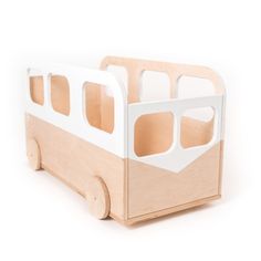 a wooden toy truck with cut out windows