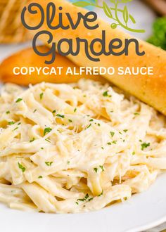 an image of a plate of food with pasta and bread in the background text reads olive garden copycat alfredo sauce