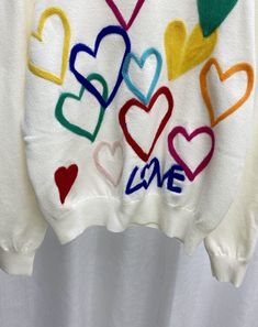 White Love Embroidered Sweatshirt | Xiumin - EXO Black L White Heart-shaped Sweater For Spring, White Trendy Sweater With Heart Print, Trendy White Sweater With Heart Print, White Casual Sweater With Heart Print, Casual White Sweater With Heart Print, Casual White Heart Print Sweater, Winter White Tops With Heart Print, White Heart Print Tops For Winter, White Embroidered Winter Tops