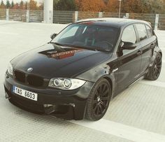 a black car parked in a parking lot