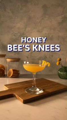 honey bee's knees cocktail on a cutting board