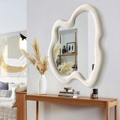 a mirror on the wall above a table