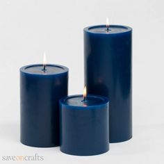 three blue candles sitting next to each other on a white surface with the words quick candles written below them