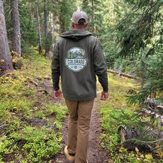 A hooded sweatshirt version of our best selling Woodland t-shirt, this Colorado hoodie is an awesome combination of organic outdoor colors and ColoradoCool's bold design style. Features a sweet outdoor Colorado landscape, big "COLORADO" text, Colorado's established date and a nice subtle topo map in the background. The smaller design on the front is perfect for those who like to put into practice a little bit of that "mullet approach", business in the front and party in the back. Snag this sweet Winter Half-zip Outdoor Hoodie, Half-zip Fleece Hoodie For Outdoor, Sweat-resistant Hooded Hoodie For Outdoor, Colorado Hoodie, Green Moisture-wicking Hoodie For Outdoor, Outdoor Half-zip Hoodie With Drawstring, Colorado Outfits, State Of Colorado, Hoodie Green