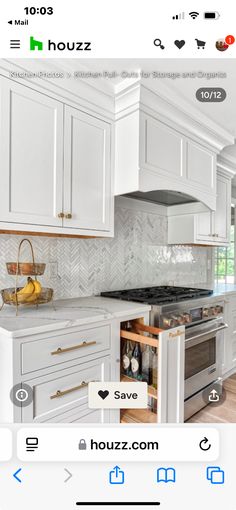 a kitchen with white cabinets and an oven in the center is featured on houzz com