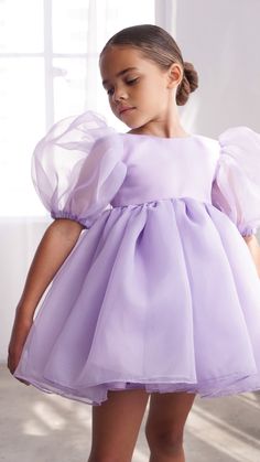 The most perfected magical short puff sleeve lavender dress. Perfect for any occasion, it's subtle & elegant yet fun! This voluminous puff sleeve dress has a layered organza, a round high neckline, with a v-low back brought together by a lavender pearl button.  Bloomers included for sizes 6m-7yrs.    COMPOSITION OU Organza Outer, Lavender Dress, Dress For Kids, Lavender Dresses, Short Puff Sleeve, Baby Gown, Puff Sleeve Dress, Organza Fabric, Puffed Sleeves Dress