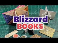 an origami book with the words blizzard books on it and some other items