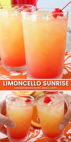 two glasses filled with drinks sitting on top of a table next to an orange slice