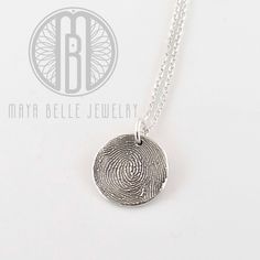 "Your actual Finger print or thumb print preserved forever in pure silver as a wearable keepsake. Each piece comes with a sterling silver, 22\" adjustable chain. Choose from either a small (16mm/.5\") or large (21mm/.75\") fingerprint circle. Each orders comes with a sterling silver, 22\" adjustable cable chain. Layer and stack multiple necklaces! Each piece includes 3 letters or initials engraved on the reverse. More engraving can be added (as long as it will fit on the charm) however, there wo Minimalist Hand Stamped Keepsake Jewelry, Minimalist Hand Stamped Memorial Jewelry, Minimalist Etched Jewelry For Keepsake, Thumbprint Necklace, Multiple Necklaces, Thumb Print, Fingerprint Necklace, Thumb Prints, Engraved Initials