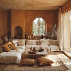 Mediterranean living room showcasing warm earthy tones of terracotta ochre and sienna for a cozy atmosphere Tiled Walls Living Room, Mediterranean Design Interior, Medditeranean Style Home Interior Design, Medditeranean Style Home, Mediterranean Villas