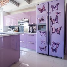 a kitchen with purple cabinets and butterflies on the refrigerator door, along with a chandelier hanging from the ceiling