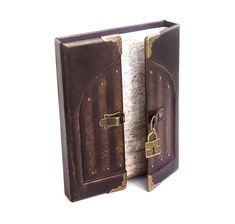 an open book with a lock and key on the pages is shown in front of a white background