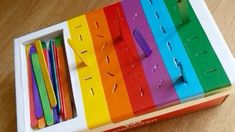 there are many different colored pencils in the box