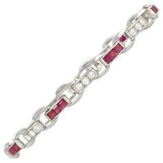 Cartier Art Deco Calibré Ruby and Diamond Bracelet in Platinum | From a unique collection of vintage Link Bracelets at https://www.1stdibs.com/jewelry/bracelets/link-bracelets/. Cartier Single-cut Diamond Bracelets, Cartier Bracelets With Single Cut Diamonds, Cartier Diamond Bracelet For Anniversary, Cartier Round Bracelet With Single Cut Diamonds, Cartier Round Diamond Bracelet With Brilliant Cut, Classic Cartier Bracelet With Single Cut Diamonds, Cartier Fine Jewelry Bracelet With Diamond Accents, Cartier Diamond Bangle Bracelet, Classic Cartier Diamond Bracelet With Accents