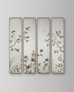 four panels with flowers and leaves painted on them in gold, white and grey colors