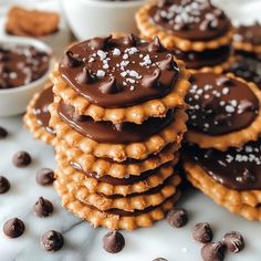 chocolate covered cookies are stacked on top of each other