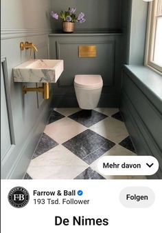 a bathroom with black and white tile flooring next to a sink, toilet and window