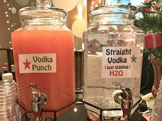 there are two large jars with drinks in them