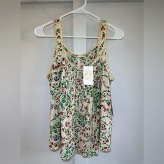 Floral Tank Top Never Worn Yellow Floral Print Tank Top For Spring, Summer Yellow Floral Print Tank Top, Spring Patterned Tank Top, Beige Floral Print Summer Tops, Summer Beige Floral Print Tops, Patterned Tank Top For Spring, Patterned Sleeveless Cotton Blouse, Yellow Bohemian Tank Top For Spring, Sleeveless Patterned Blouse For Spring