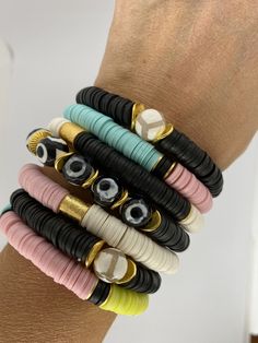 "This listing is for TWO bracelets. The bracelets are made with African clay discs and gold accent beads. My hand-beaded bracelets are made with stretch elastic which makes it comfortable and easy to wear. My bracelets are made to fit an average wrist size of 6.5\"-7\". Take a look around my shop for additional colors to add to your stack! The more the better! I've included pictures to give you an idea of bracelets to add to your set." Adjustable Stackable Rondelle Bracelets, Adjustable Stackable Rondelle Stretch Bracelet, Stackable Heishi Beads Bracelets, Adjustable Stacked Heishi Beads Stretch Bracelet, Adjustable Stackable Stretch Bracelet With Round Beads, Adjustable Stackable Stretch Bracelet, Adjustable Stacked Beaded Bracelets With Round Beads, Adjustable Stacked Round Beaded Bracelets, Adjustable Multicolor Stretch Bracelet With Black Beads