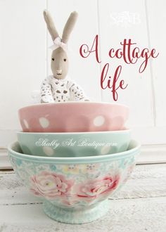 a stack of bowls with a bunny sitting on top of it and the words, a cottage life above them