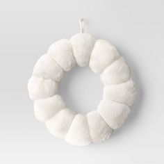 a white wreath hanging on the wall