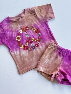 Discover the perfect ensemble for your little fashionista with our trendy toddler girl outfit sets on Etsy! Our matching sets for babies and toddlers are the epitome of style and comfort, featuring adorable two-piece combinations that are sure to make your child stand out. Dive into our collection of trendy girly outfits, including the must-have floral peace sign shirt for girls, paired with chic biker shorts. Each set showcases a unique violet and beige tie-dye design, adding a splash of color Cotton Playwear Sets With Graphic Print, Cotton Graphic Print Playwear Sets, Cotton Graphic Print Sets For Playwear, Playful Graphic Print Summer Sets, Playful Graphic Print Sets For Summer, Playful Matching Sets For Spring, Cute Cotton Sets With Graphic Print, Playful Spring Matching Sets, Pink Cotton Sets For Summer