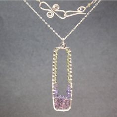 "Hammered rectangles with peridot, tanzanite, and amethyst wrapped inside, about 18\" long (rectangle about 2\"). Available in 14k gold filled & sterling silver, 14k rose gold filled **We now offer LAYAWAY**Please read our policy section for more info - http://www.etsy.com/shop/CalicoJunoJewelry/policy" Handmade Purple Rectangular Necklace, Purple Rectangular Amethyst Necklaces, Purple Rectangular Amethyst Necklace, Fusion Peridot Jewelry Gift, Purple Sterling Silver Rectangular Jewelry, Purple Rectangular Sterling Silver Jewelry, Fusion Style Peridot Jewelry Gift, Fusion Style Peridot Jewelry As A Gift, Lavender Tanzanite Jewelry For Gifts