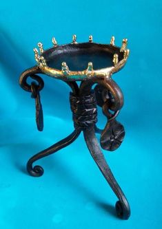 an ornately decorated metal table on blue background