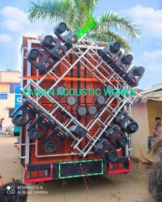 a large truck with many speakers on it's back