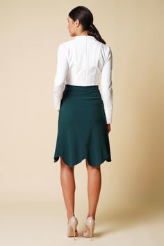 "A green skirt featuring a high-rise styling, midi length, and a trumpet silhouette. - high waist - trumpet silhouette - knee midi length - concealed back zipper closure - godet style Color: dark green Fabric: viscose - 40%, elastane - 5%, polyester - 55%. Our model wears size S (US 6) and is 178 cm / 5'8\" tall. MORE ITEMS: https://www.etsy.com/shop/TAVROVSKA?ref=hdr_shop_menu SIZE CHART XS __ EU 32 __ US 2 bust: 31,5\" | 77 cm waist: 24,5\" | 59 cm hips: 34,5\" | 84 cm XS __ EU 34 __ US 4 bust Green Knee-length Skirt For Formal Occasions, Green Flowy Formal Skirt, Formal Green Flowy Skirt, Fitted Ruffled Midi Skirt, Formal Fitted Mini Skirt With Ruffles, Formal Fitted Ruffled Mini Skirt, Green Knee-length Skirt For Workwear, Green Midi Skirt For Workwear, Fitted Flared Mini Skirt For Office