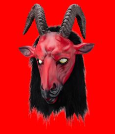 a red demon mask with horns on it's head