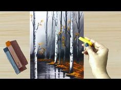 someone is drawing trees in the woods with colored pencils and watercolor paints on a piece of wood