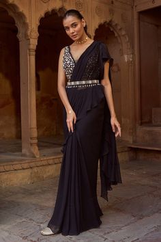 Black pre-draped frill saree. Paired with a hand embroidered padded blouse with loop detailings on the neckline and an embroidered belt. - Aza Fashions Frill Saree, Sarees Black, Ruffle Sarees, Trendy Outfits Indian, Outfits Indian, Ruffle Saree, Padded Blouse, Embroidered Belt, Drape Saree