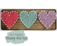 string art kit with three hearts in the shape of yarn on a wooden board and text that says do it yourself string art kit