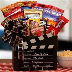 a movie themed gift basket with popcorn and snacks