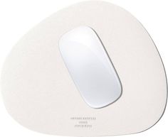 a white computer mouse pad with a rounded design on the front and back side,