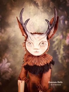 an image of a doll with antlers on it's head