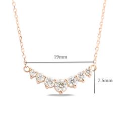 This timelessly gorgeous diamond necklace showcases brilliant white diamonds set in a lustrous 14k rose gold curved 7 stone pendant setting creating an eye-catching and chic look. The 7 diamond pendant hangs gorgeously from a solid 14k rose gold cable chain. The length of the gold chain can be adjusted to either 16" or 18" long to suit your style! This curved diamond necklace matches perfectly with our 7 stone diamond wedding bands and earrings. It can be made in your choice of white, rose, or y Classic Rose Gold Moissanite Necklace, Rose Gold Moissanite Round Pendant Necklace, Rose Gold Moissanite Diamond Cut Necklace, Elegant Rose Gold Moissanite Diamond Necklace, Dazzling Rose Gold Necklace With Prong Setting, Rose Gold Diamond Necklace With Moissanite And Diamond Accents, Rose Gold Pendant Diamond Necklace With Prong Setting, Unique Diamond Pendant, Round Diamond Necklace